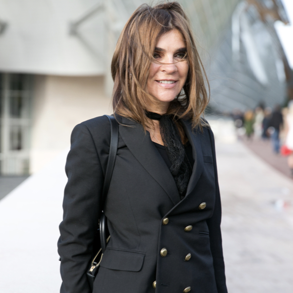 Carine Roitfeld, who's just launched her perfume line, wearing a black jacket.