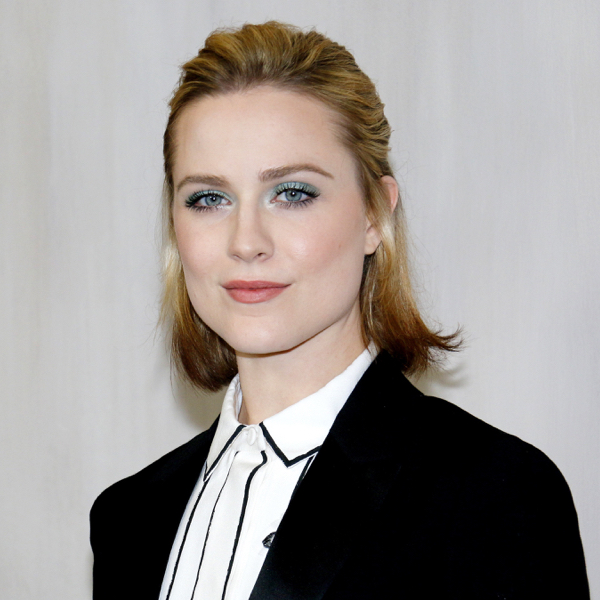 Evan Rachel Wood wears a power suit and black and white shirt.