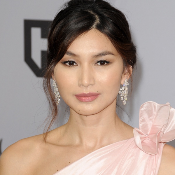 Gemma Chan wearing a one-shoulder dress on the red-carpet.