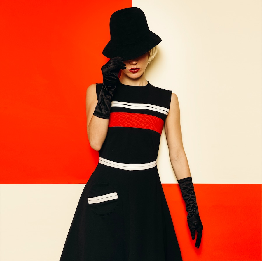 Woman wearing a minidress, the signature '60s look of Mary Quant.