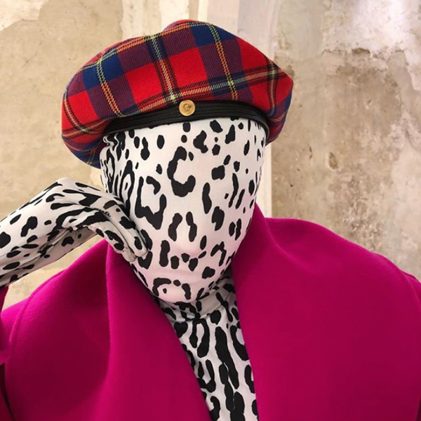 Checking invoices Instagram with model wearing a tight on the face