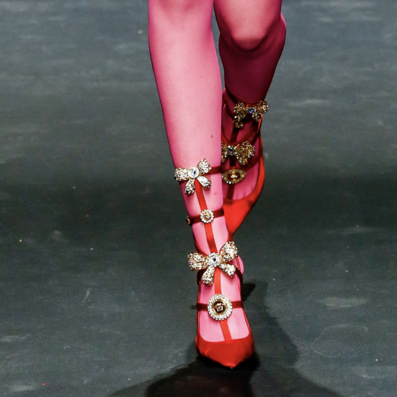 Bejewelled red high-heel pumps.