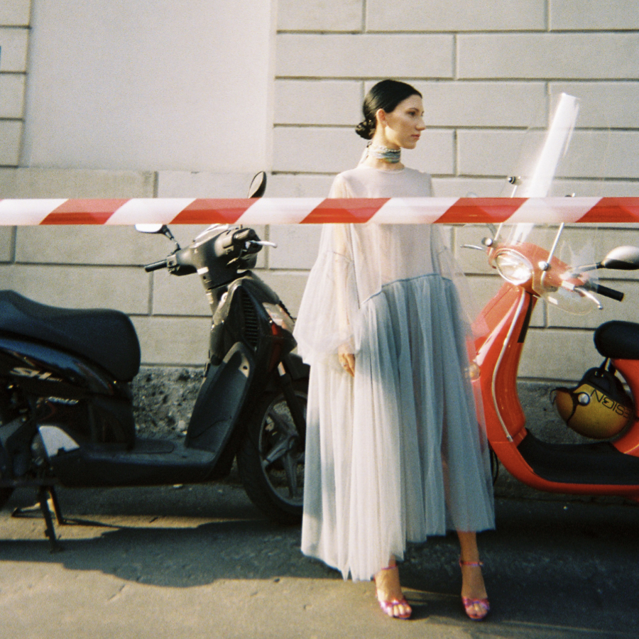 fashionista at milan fashion week on the street wearing a oversized sheer dress; a perfect post-lockdown office outfit for this summer.