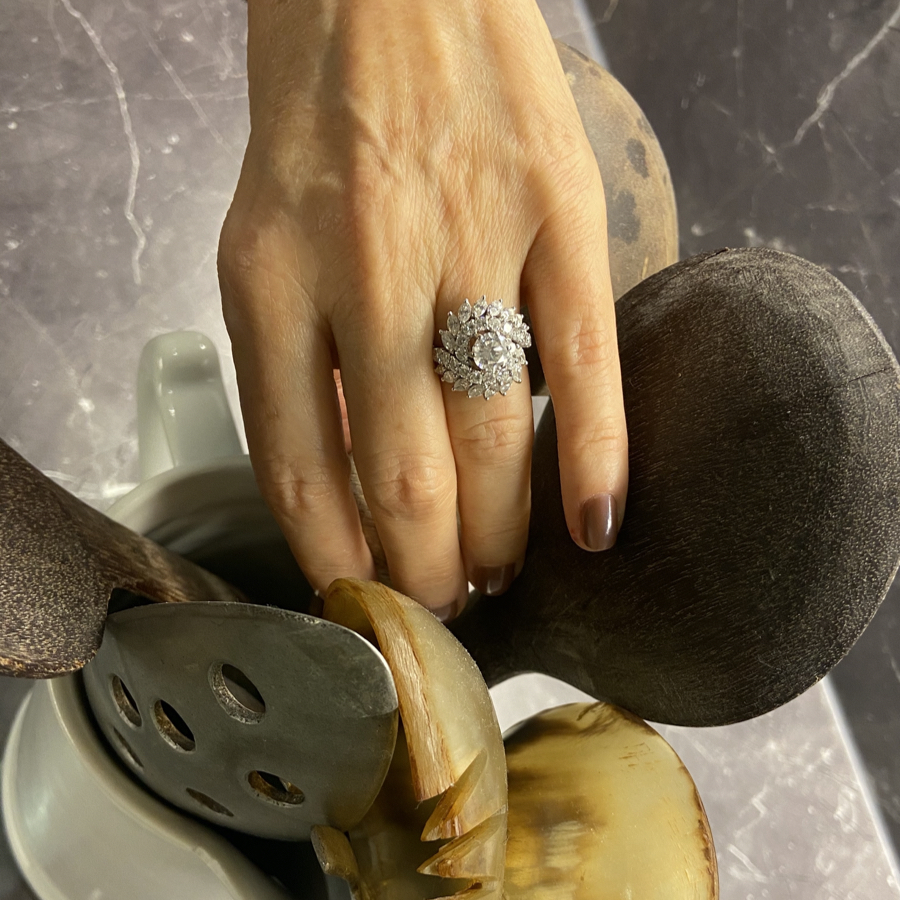 Selma von Schoenburg, Notorious Mag editor-in-chief, wearing a diamond ring while picking a wood salad spoon from the kitchen