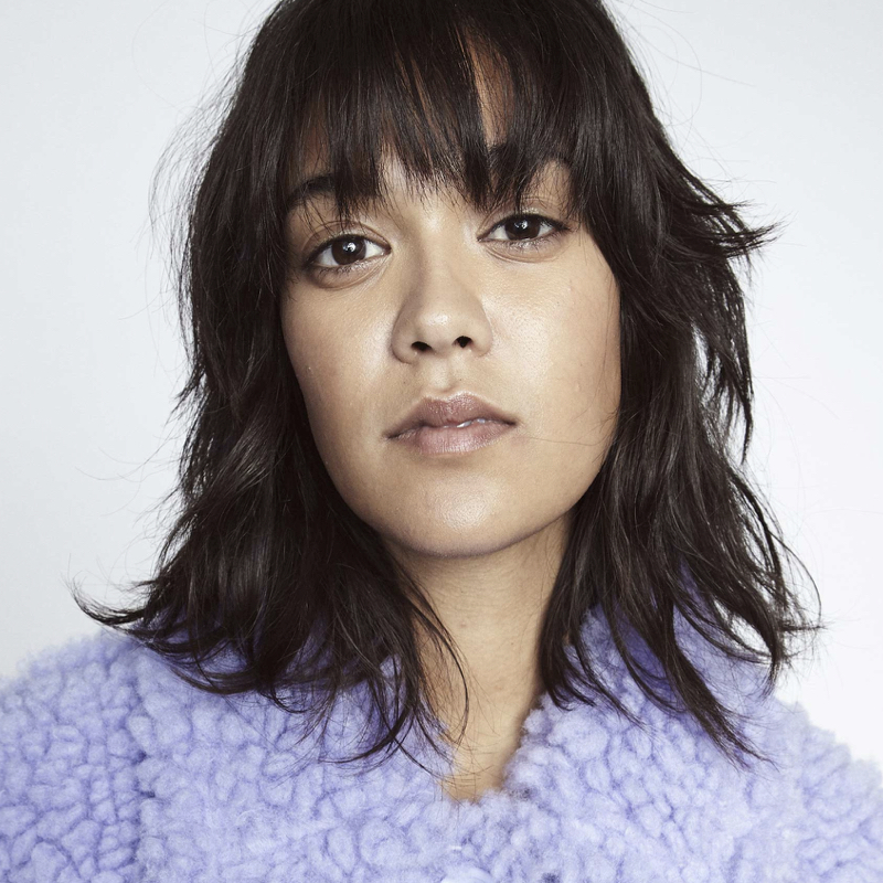 Woman wearing one of the cool faux fur coats by fashion label Stand Studio.