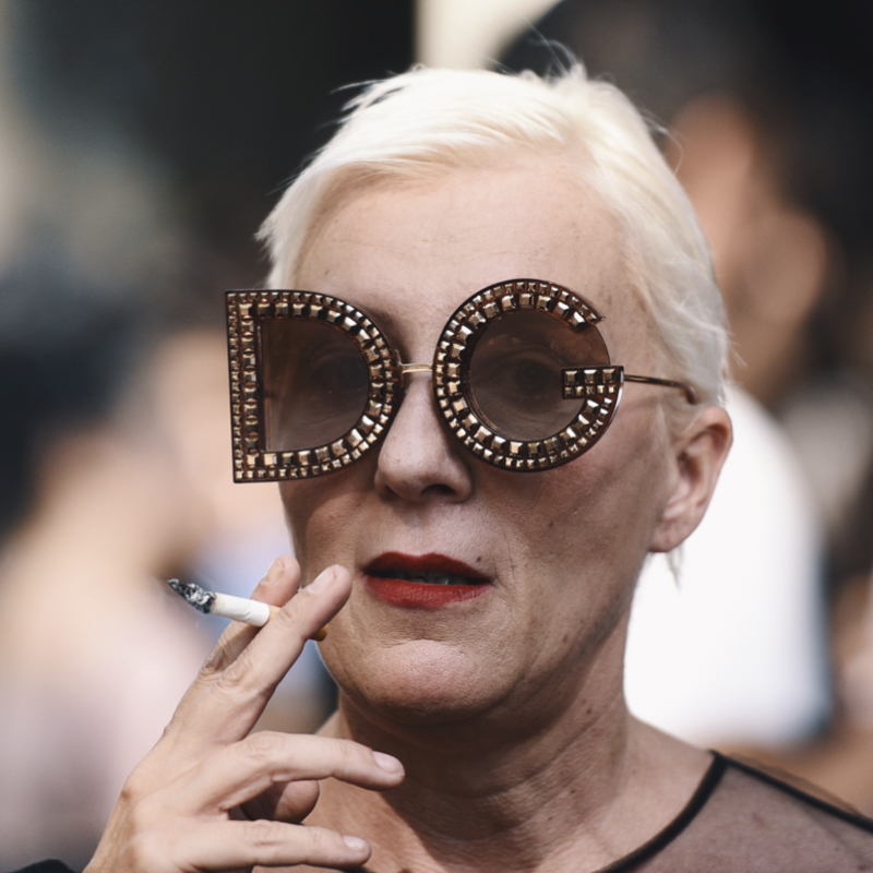 Woman wearing fun sunglasses, a jolly accessory for your winter wardrobe.