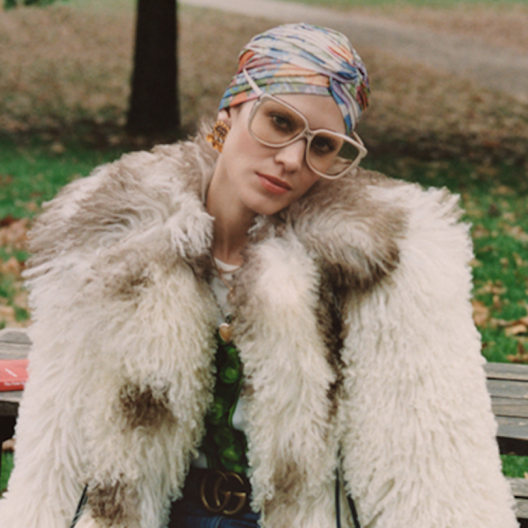 Walking in the park in style with turban and sunglasses.