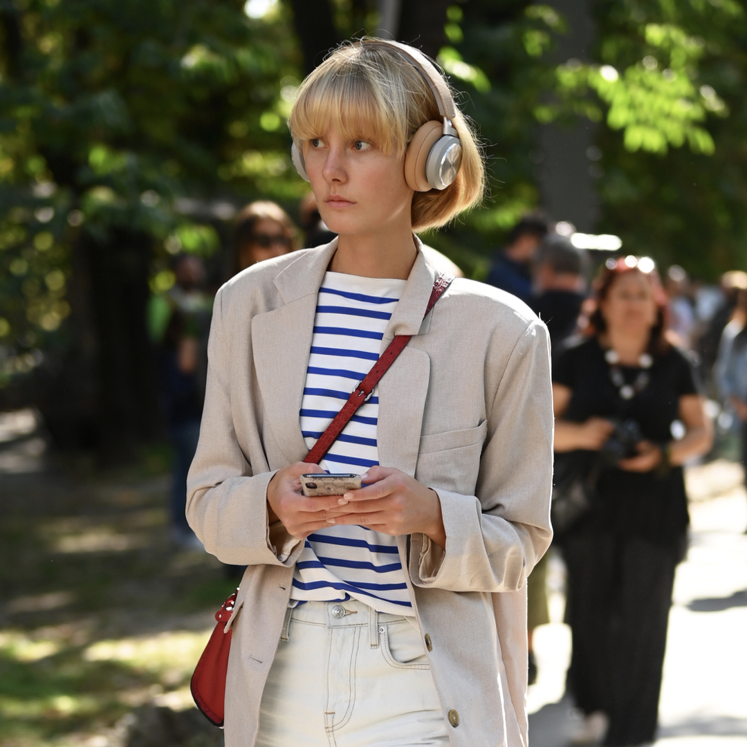 Woman wearing striped tee and blazer, the best spring outfit for office and home office.