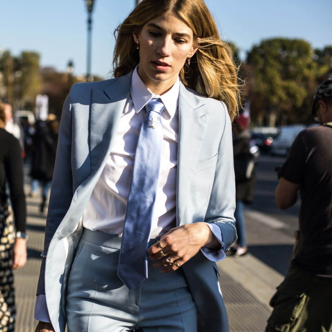 Model Veronika Heilbrunner wearing a power suit blue in the streets of Paris fashion Week