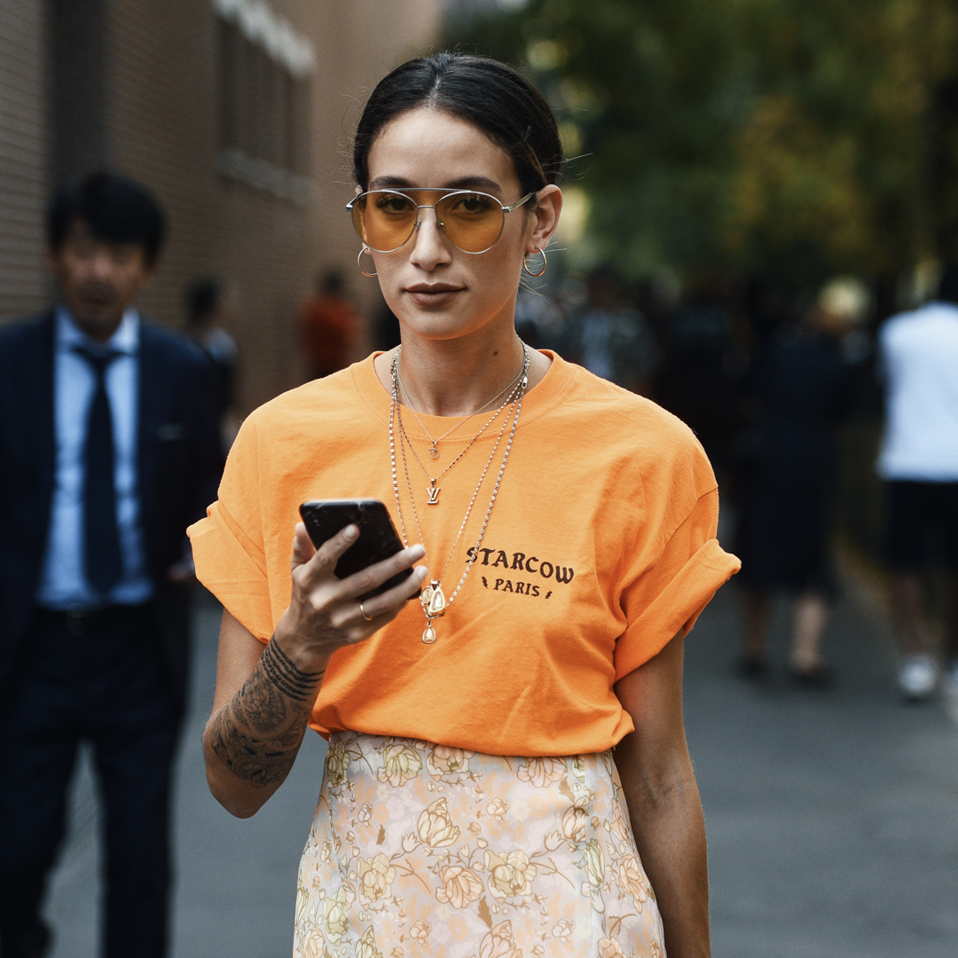 street style fashion week, fashionista wearing a all year round look with t-shirt and pencil skirt all in orange