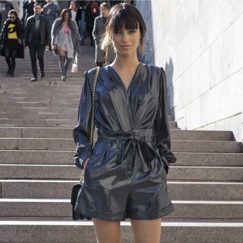 Street style photo of a fashionista wearing a faux leather bomper during Paris Fashion Week