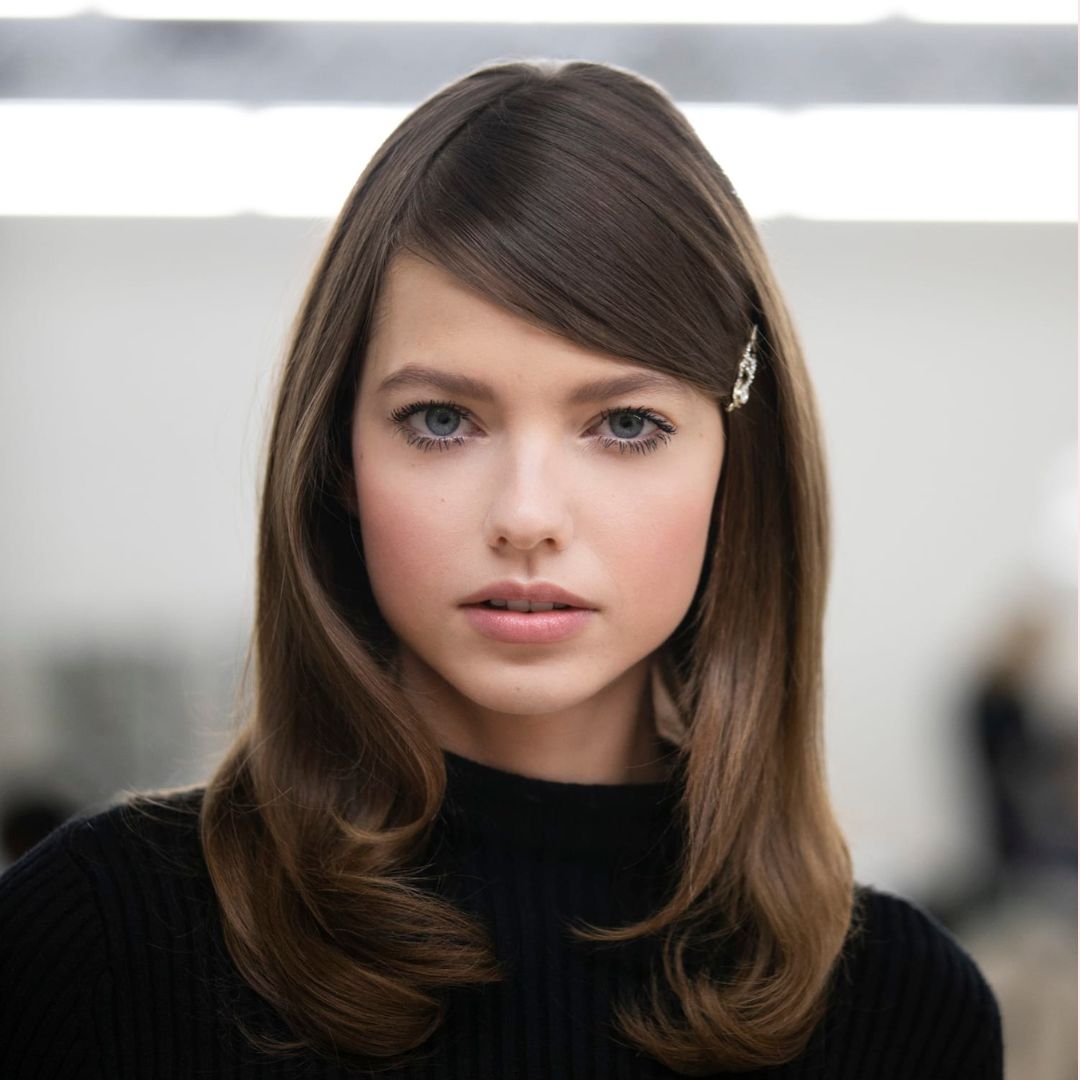 Chanel model wearing a no makeup look from wW22-23 runway shoe