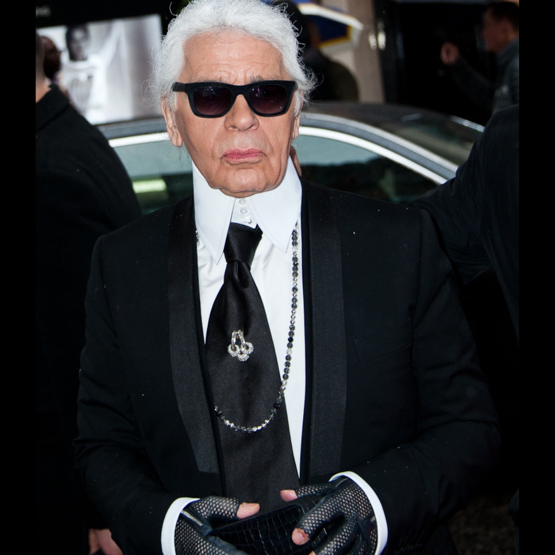 Karl Lagerfeld wearing a black tie and chanel jewellery in the opening of Fendi store in Italy