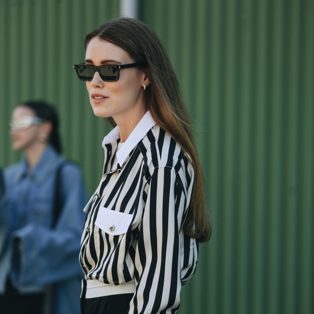 Fashionista at CPHFW, wearing a striped blouse as a fashion trick to look taller