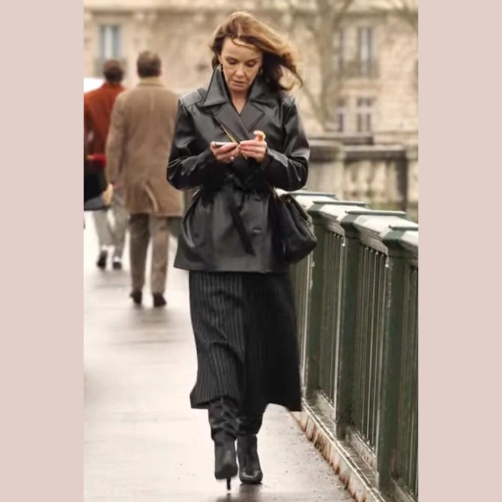 Sylvie Grateau_Philippine Leroy-Beaulieu_wearing a leather jacket paired with a striped skirt and black boots