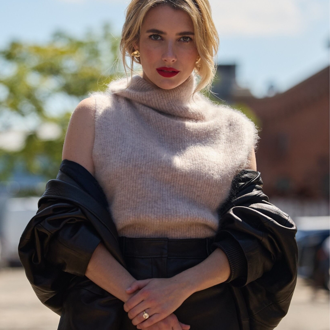 Emma Roberts wearing a sleeveless pullover from COS in front of the venue where the brand did its AW24-25 presentation at New York Fashion Week