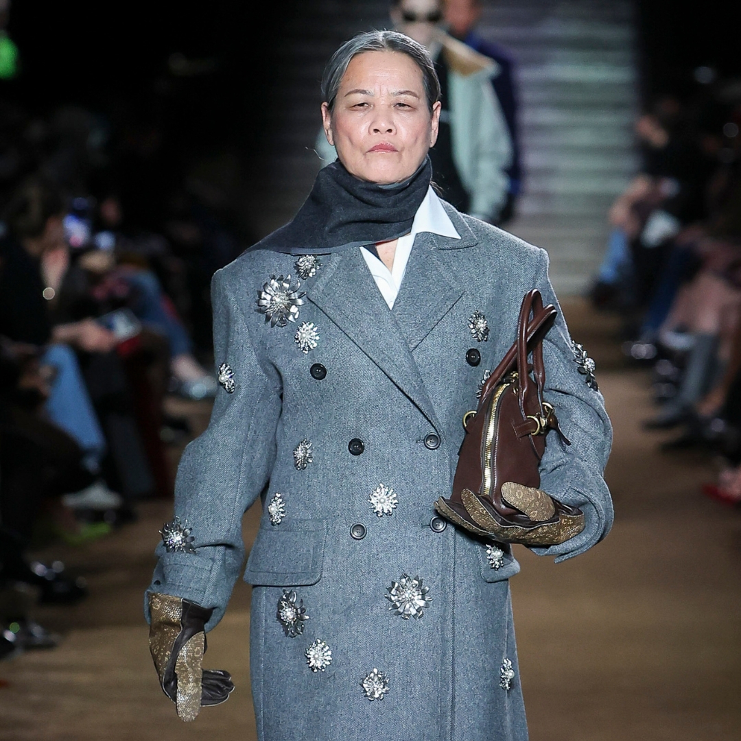 Chinese doctor Qin Hualin in the AW14-15 Miu Miu runway wearing a embroidered grey wool coat