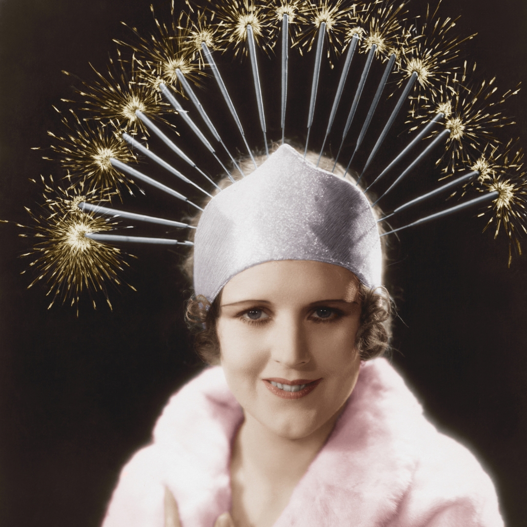 vintage photo with a woman wearing a hat with many party candles