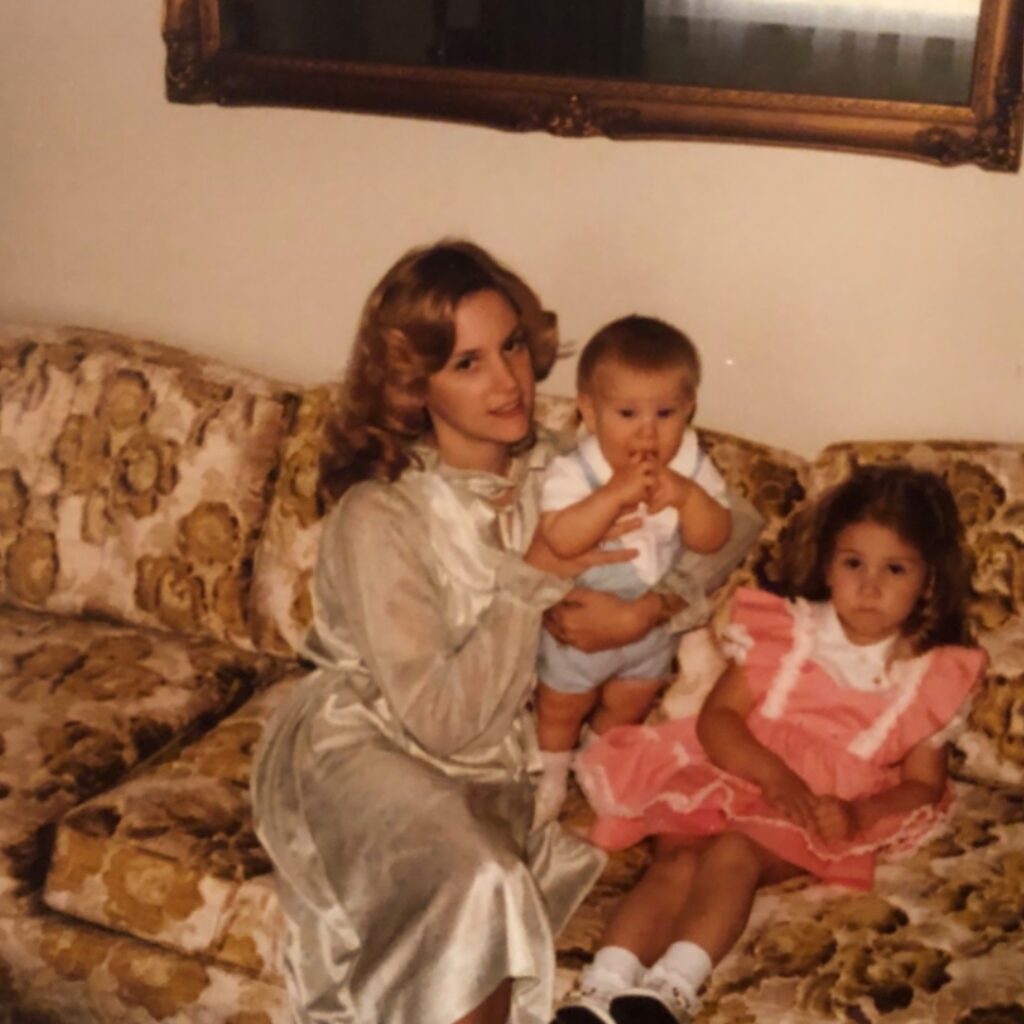 Peggy Lynn Garner with Jeff and sister Melissa- wearing clothing designed by Peggy