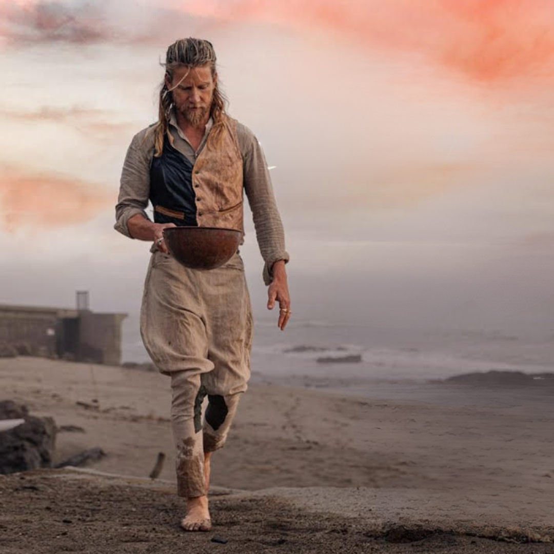 Poster of the documentary let them be naked showing Jeff Garner walking on a beach during sunset
