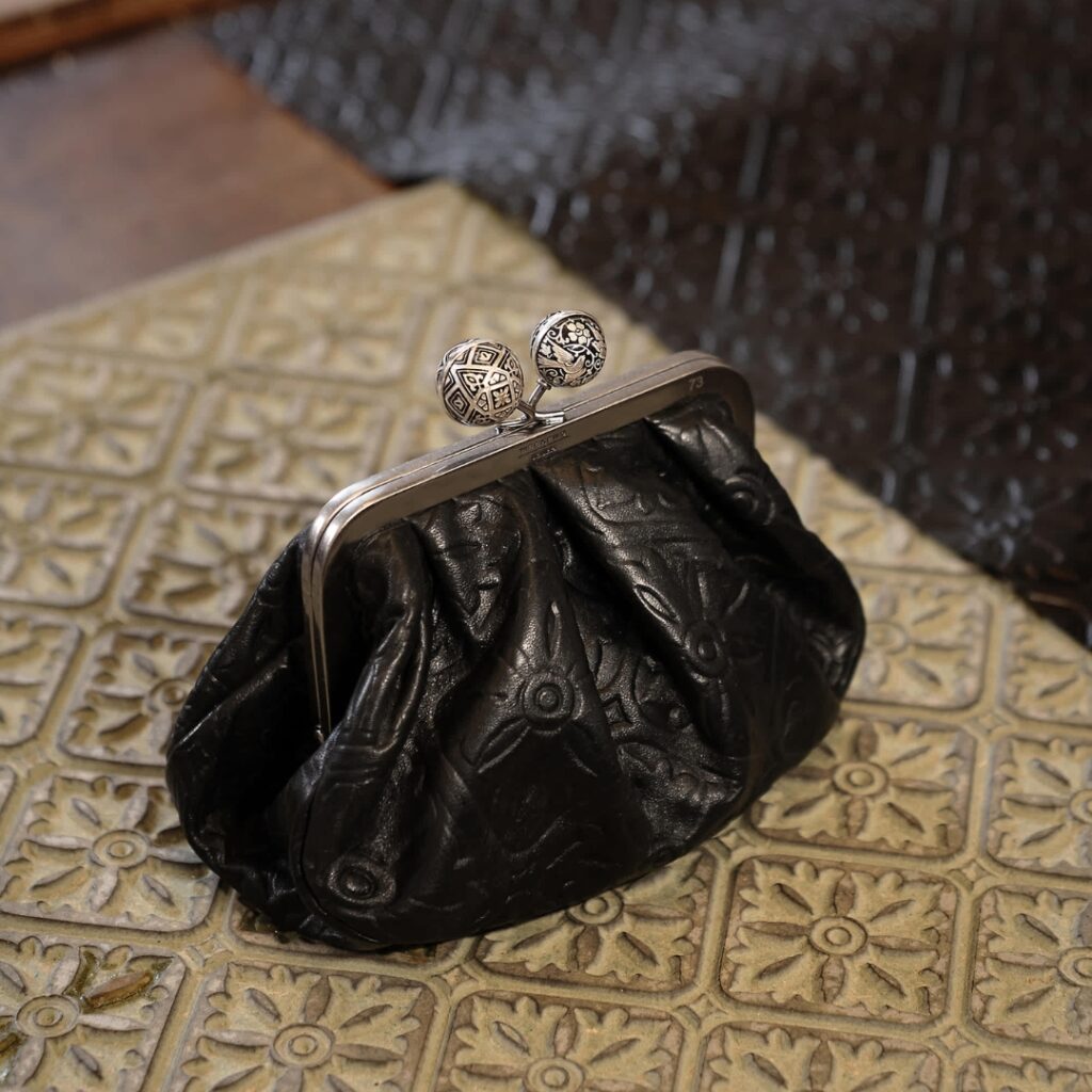 Pasticcino Bag photographed over a piece of leather from Cueros Ghadames from Andalucia