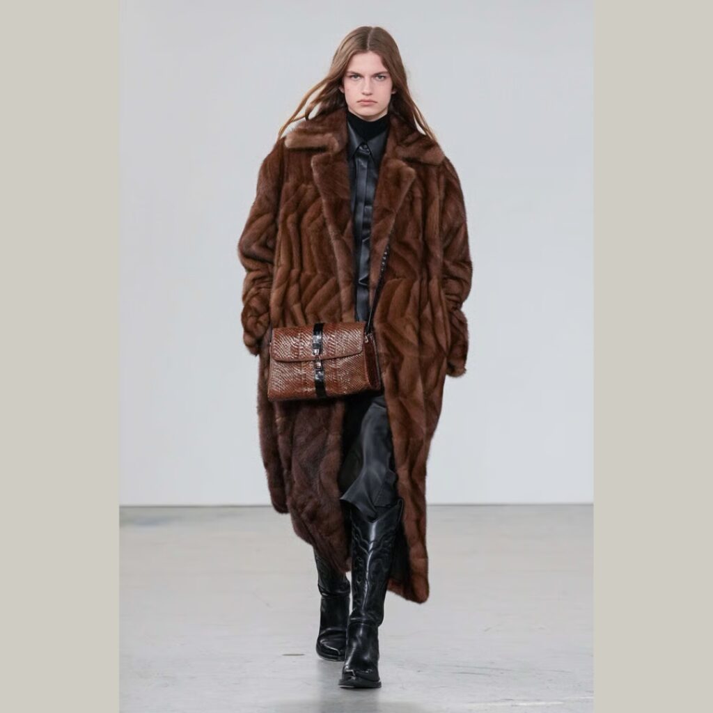 Cowboy-boots-styled-with-tailored-pants-and-fur-Fall-2025-look