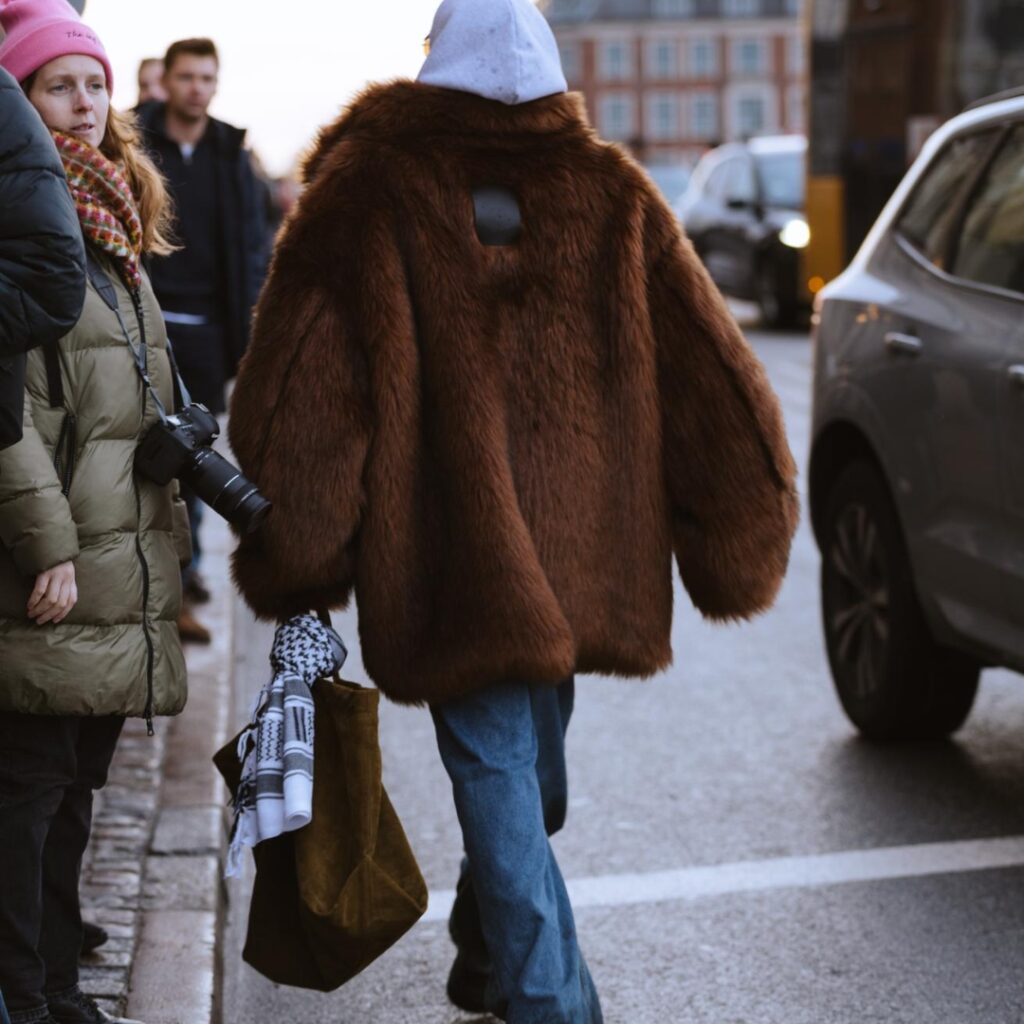 fashionista carrying a palestinian scarf as a charm bag during CPHFW