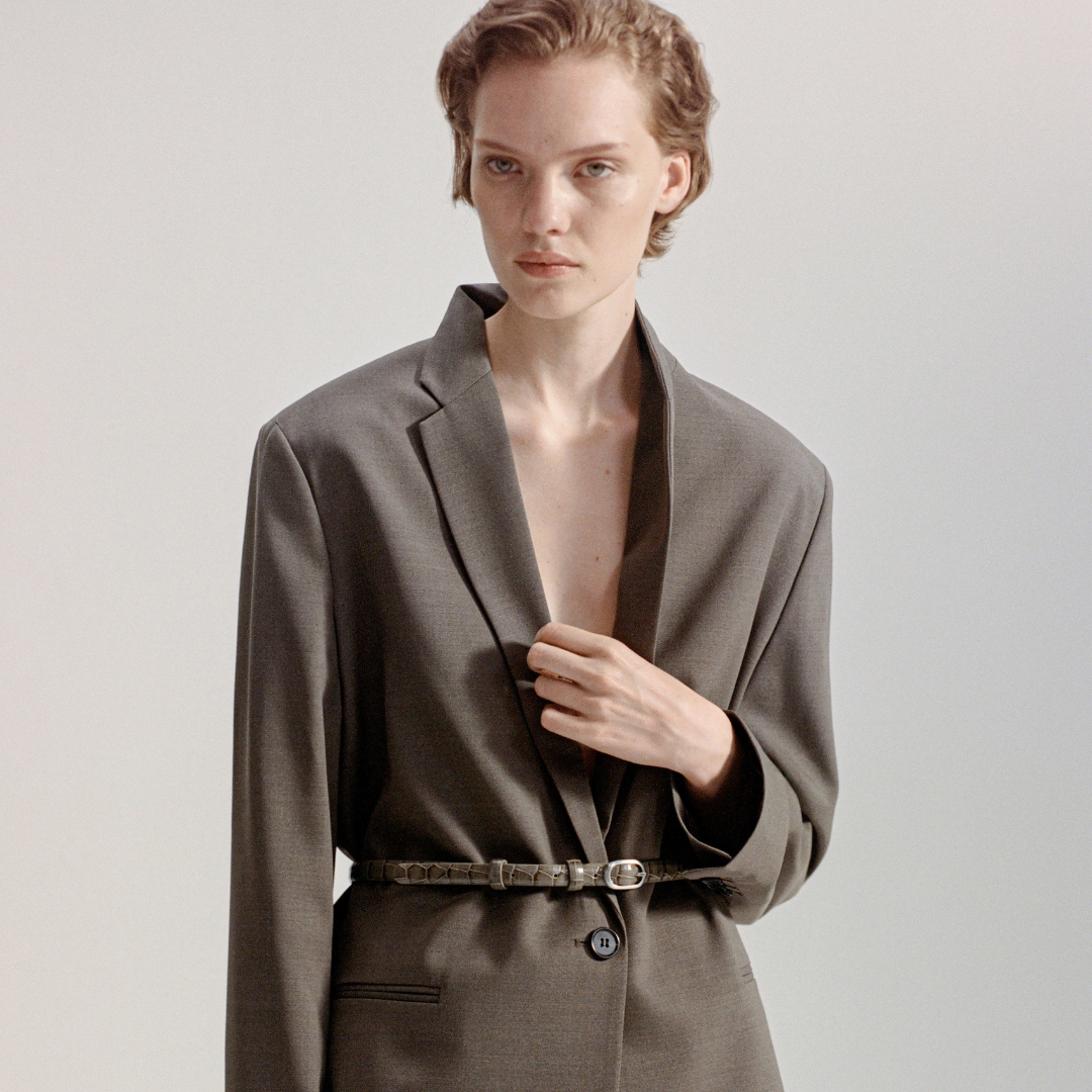 Model wearing a brown suit from COS-Giorgio Armani inspiration