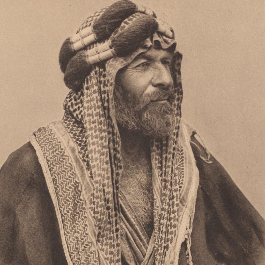 Male  Sheik wearing a Palestinian scarf to protect him to the sun.