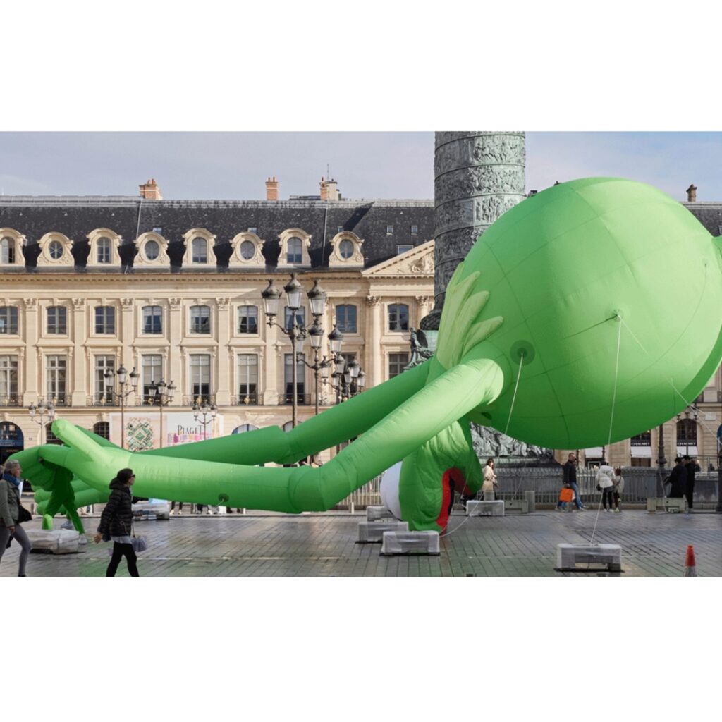 Art Basel Paris 25- A Giant inflatable Kermit the Frog by Alex Da Corte at Place Vendome