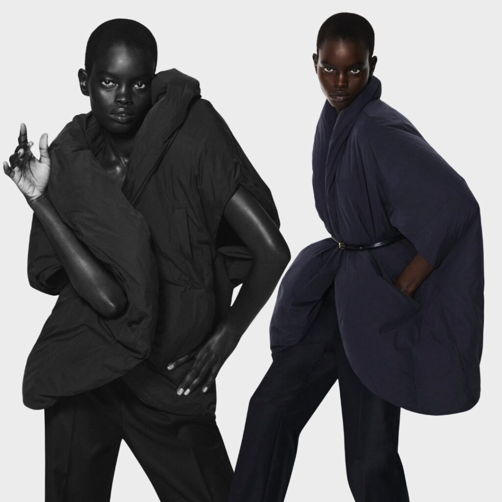 Model wearing sculptural down jacket from COS Festive Collection 2025