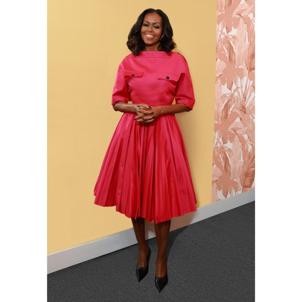 Michelle Obama wearing a monochrome Prada outfit at a public event, promoting her new The Look book