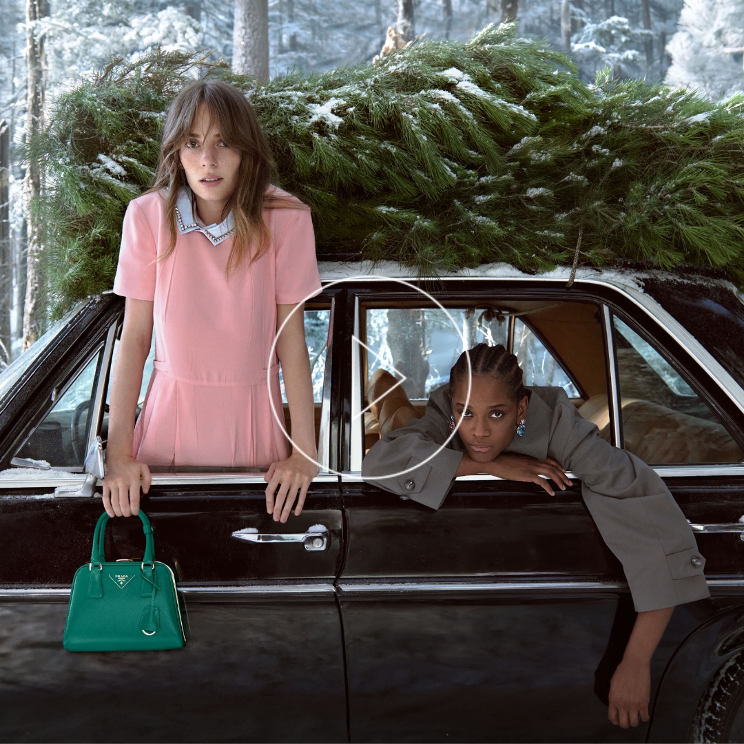 Prada Christmas 2025 campaign still of friends driving through snowy mountains, photographed by Glen Luchford