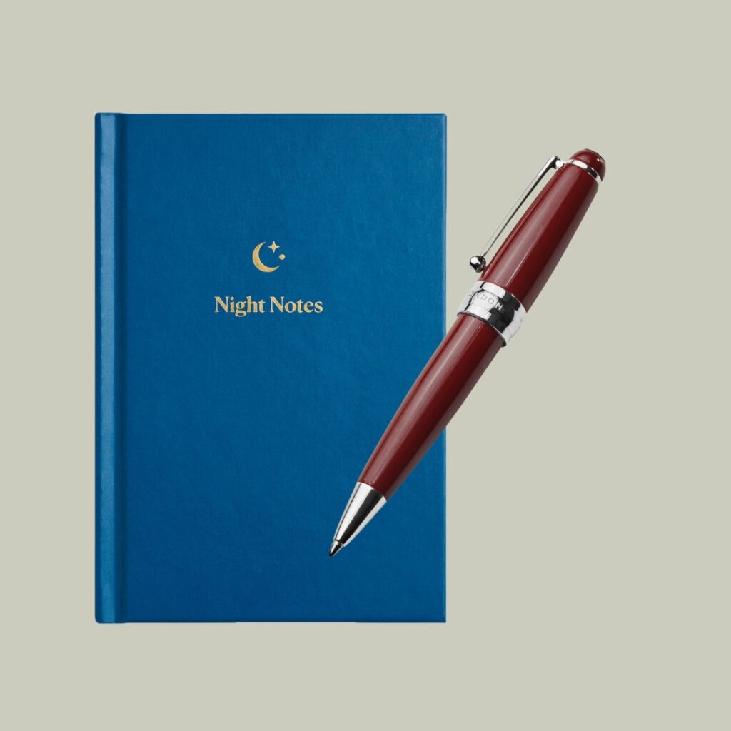 Blue journal with a pen resting on top - collage