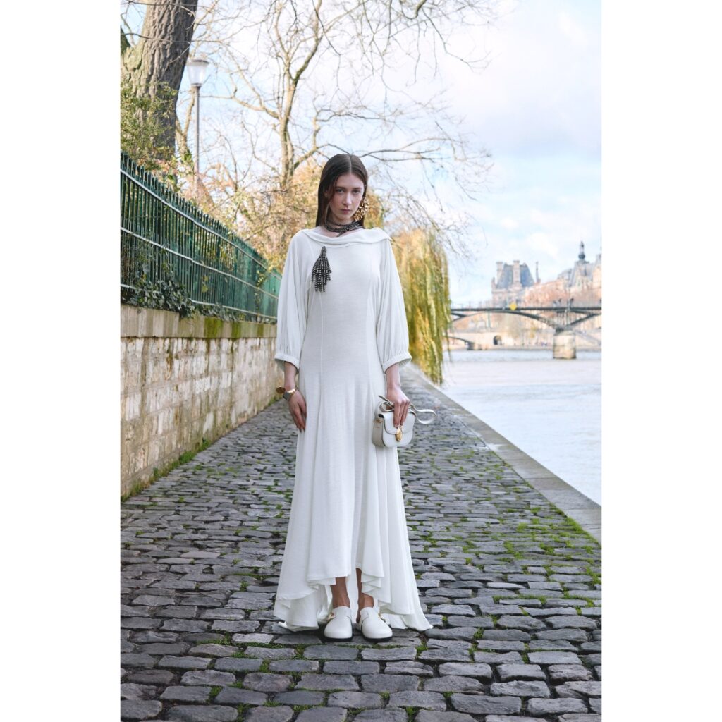 Model wearing a white dress from Dior Fall 2026