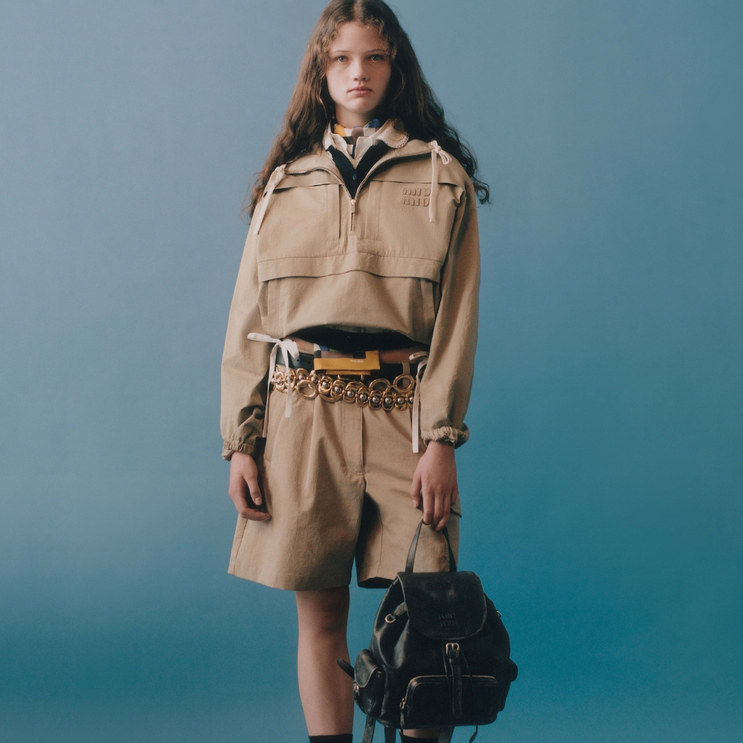 Model wearing a bermuda and jacket from Miu Miu Prelude 26 collection