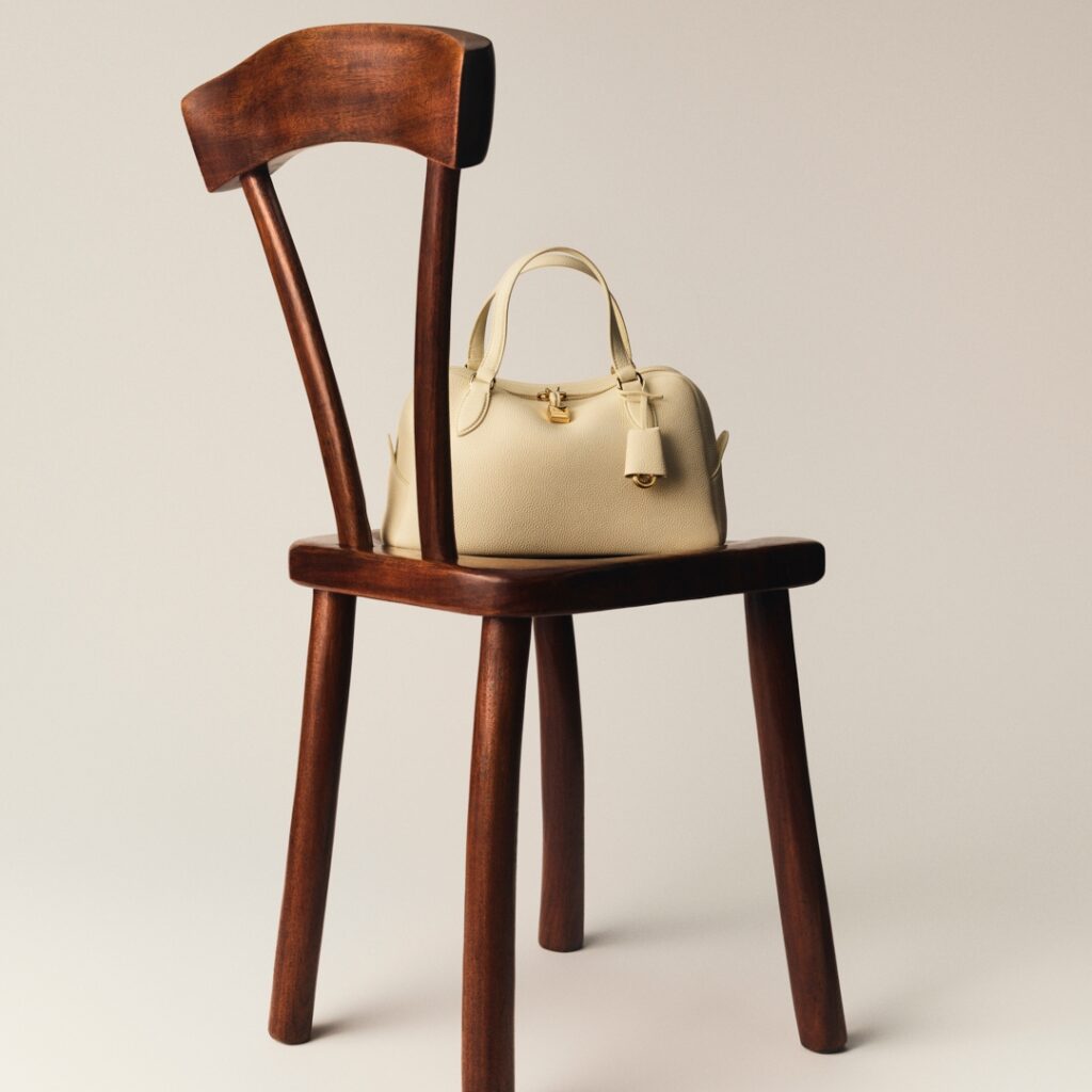 Needle bag from Loro Piana photographed by Charles Negre with wood sculpture by Alexandre Noll 