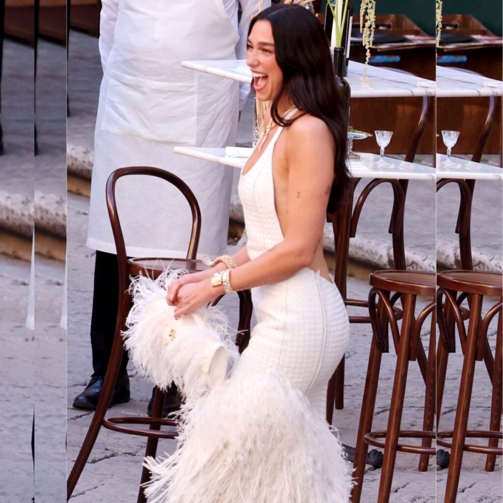 Dua Lipa in Palermo celebrating her wedding in a bottega veneta gown