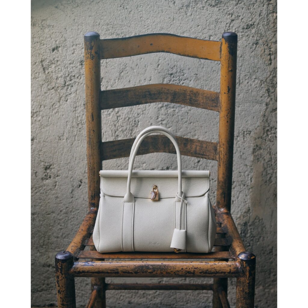 Loro Piana Loom bag photographed on a chair