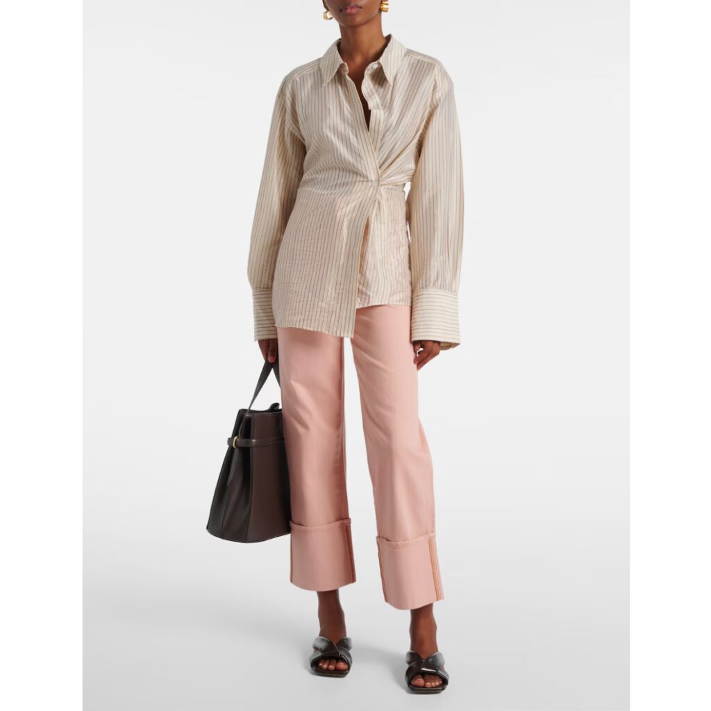 model wearing veronica beard pale pink jeans