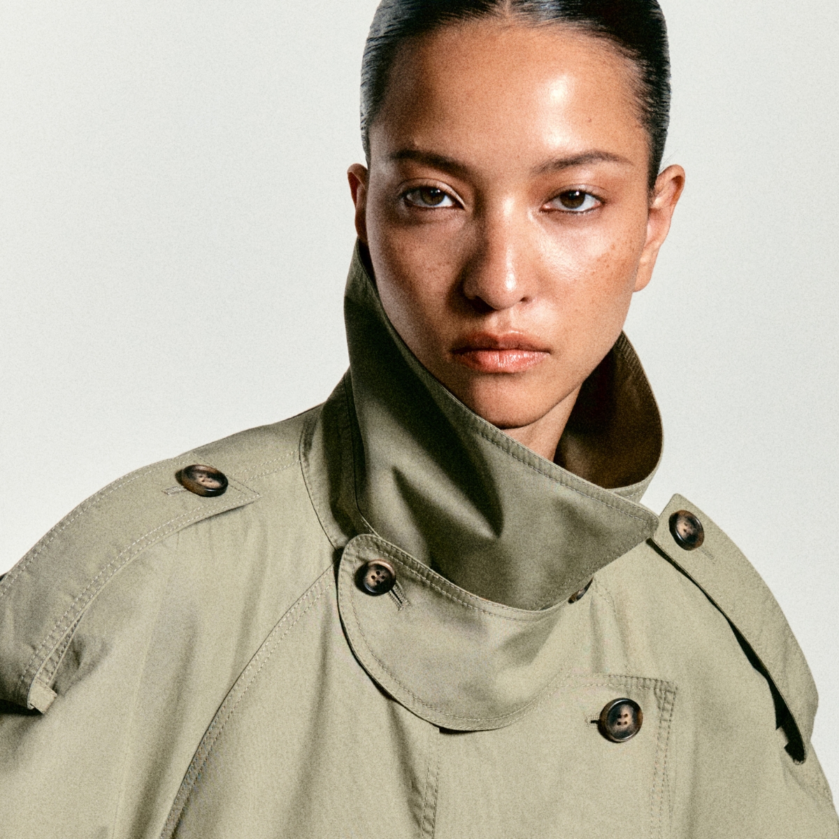 Fall 2026- COS model wearing funnel-neck trench coat