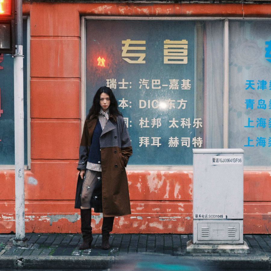 model in the streets of Shangai wearing Essential Antwerp Fall 2026